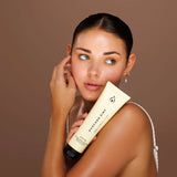 Woman applying Avocado Zinc SPF 30 Natural Body Sunscreen for hydrated sun protection