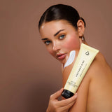 Woman holding Avocado Zinc SPF 30 Natural Body Sunscreen for natural mineral sun protection