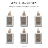 “Year of Magnesium” bundle showing six Behrhaus Vanilla Magnesium Oil bottles arranged in two rows, with text indicating “6 Magnesium Oil delivered right on time for the year,” on a clean white background.