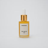 rise brightening face oil in a glass bottle with gold top